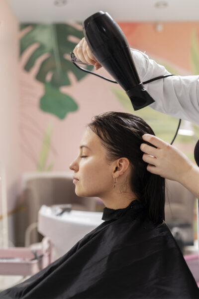 woman-getting-treatment-hairdresser-shop